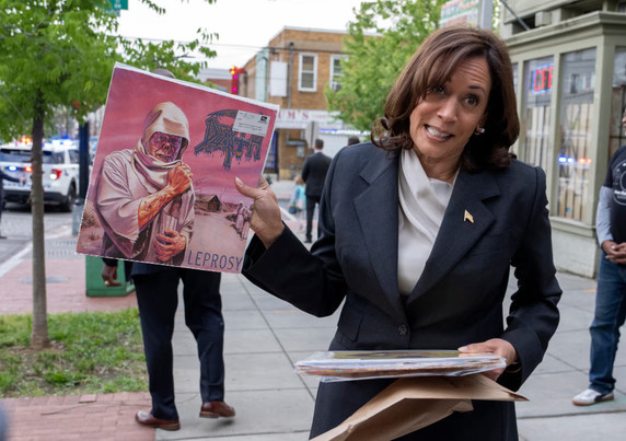 Picture of Kamala Harris holding a copy of Leprosy by Death