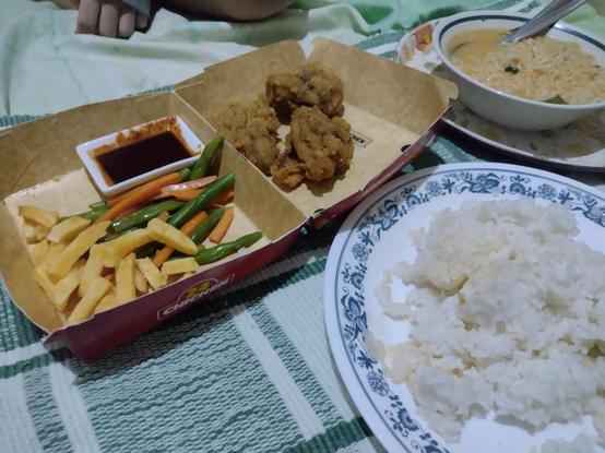 Clockwise from left: 
Takeout box w/ bbq dip, boneless chicken, baguio beans, carrot and potato sticks. 
Bowl of instant ramen. 
Plate of leftover rice.
