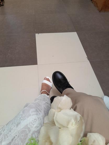 POV of a couple's shoes during a wedding